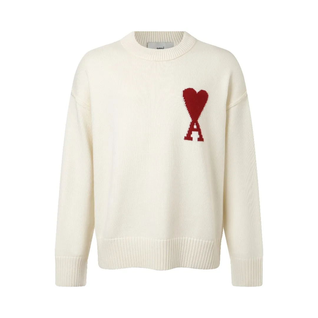 AMIRed ADC Loose Crew Neck Sweater Fabric Selection: Made from a blend of selected wool and long-staple cotton. The natural curly fibers of wool form an air layer, locking in heat and improving the warmth coefficient; the cotton fibers give the fabric good hygroscopicity and breathability, balancing the slight tackiness of wool, making it more comfortable to wear next to the skin. The surface shows natural fine velvet, the luster is soft and not dazzling, and the loose silhouette makes it look more lazy and advanced. After pre-shrinking, the shrinkage rate is controlled within 3%, and it is not easy to deform after washing. Process 1: Using high-elastic rib weaving method, using wool-cotton blended yarn as raw material, interwoven through 24-needle combing machine. Each centimeter contains 8-10 stitch loops, forming a fine and tight horizontal pattern with both elasticity and rebound power. The neckline adopts a double-layer thickening design, and the inner layer has invisible reinforced wiring to ensure that it is not easily deformed after long-term wear; the cuffs and hem ribs are blended with 10% spandex, which maintains a crisp silhouette while giving the skin a soft wrapping feel. Process 2: The Red ADC pattern on the chest uses intarsia jacquard technology, using Red wool yarn as the main body, and the direction of the colored yarn is precisely controlled by a computerized flat knitting machine, and the letters and heart-shaped totem are seamlessly integrated into the beige base. The yarn density in the jacquard area is higher than that of the body, with 12 needles per square centimeter. The edges of the pattern are processed with "no dotted line connection" technology to avoid accumulation of thread ends on the back. The front lines are smooth and clear, and the colors are contrasting. Accessories: One-to-one customized three-standard Size: S M L XL Style number: D 237